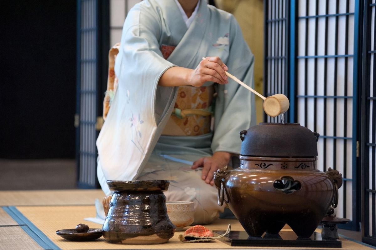 A quiet tea ceremony moment showing a tea bowl and soft light in a traditional Japanese tea room