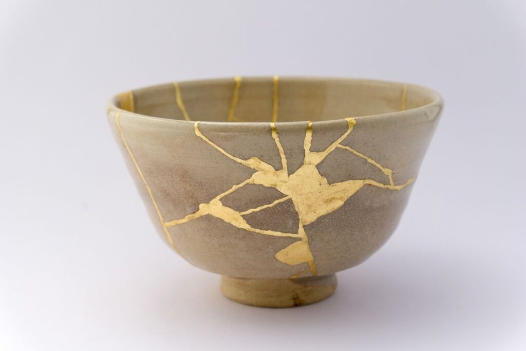 A repaired Japanese tea bowl highlighting wabi-sabi aesthetics and the beauty of imperfection