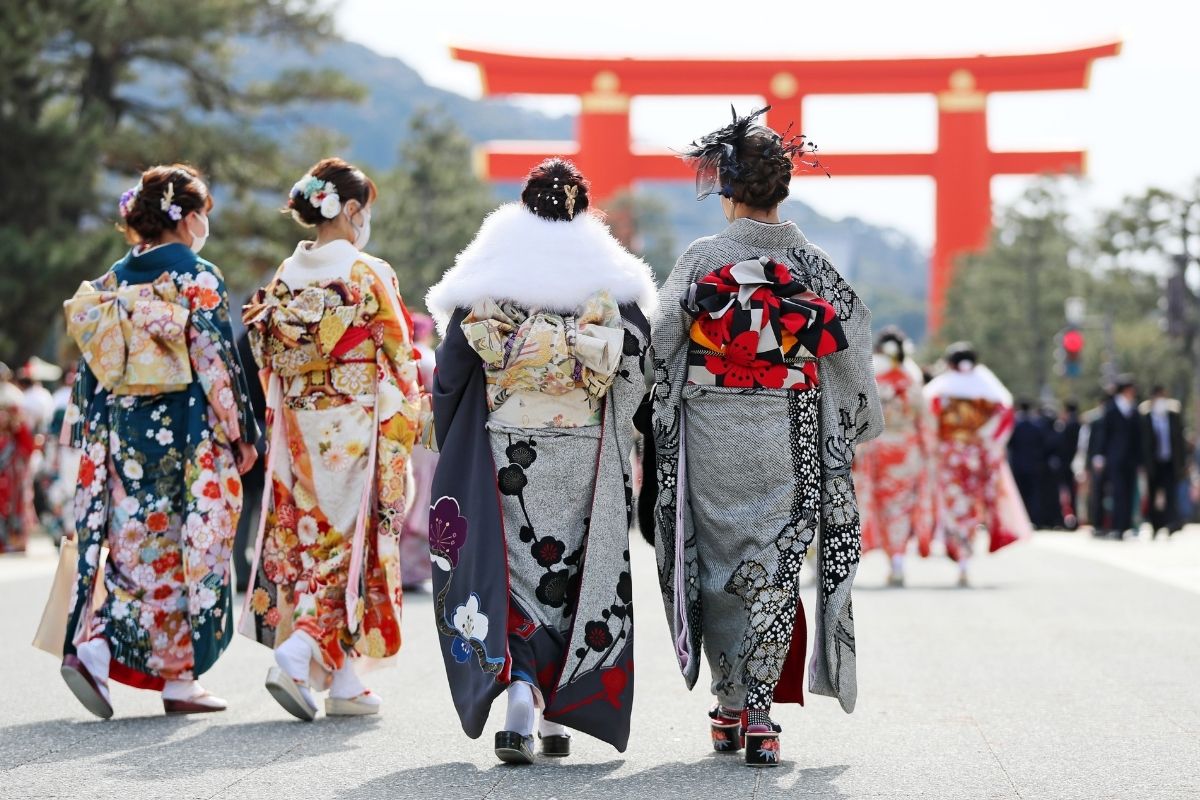 Woman wearing kimono with calm posture in a quiet Japanese setting