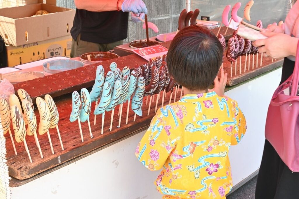 Street food stalls at a Japanese festival, capturing the warmth and everyday joy of matsuri culture