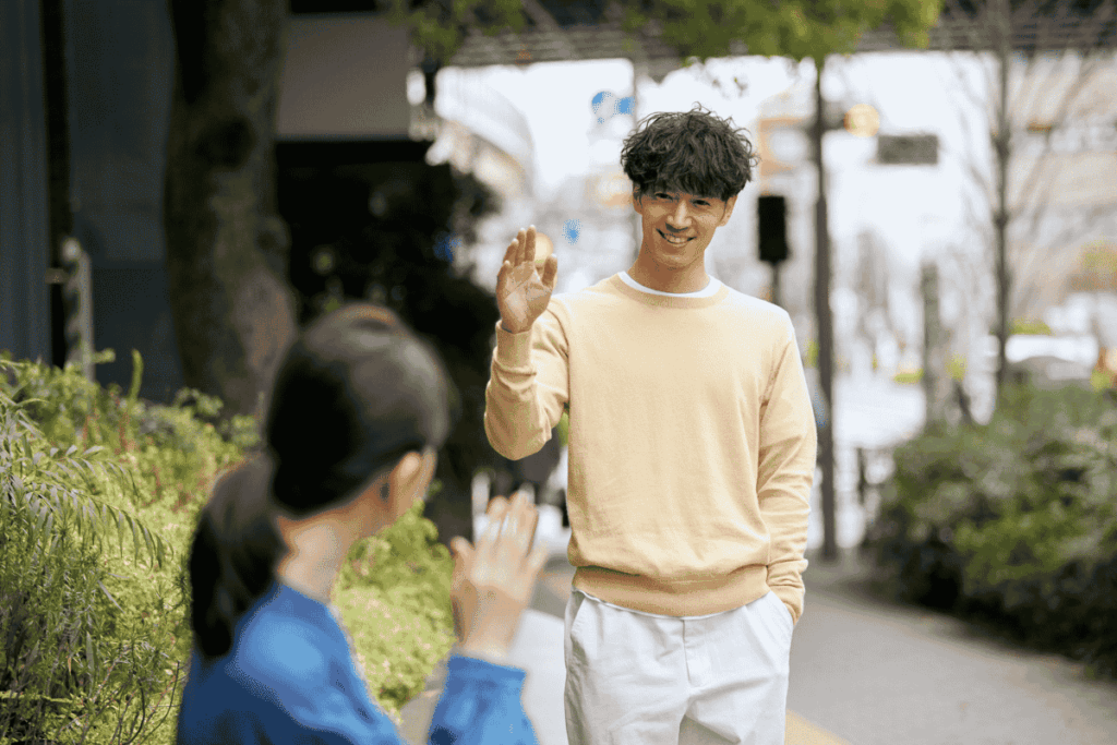 Two people in Japan politely interacting